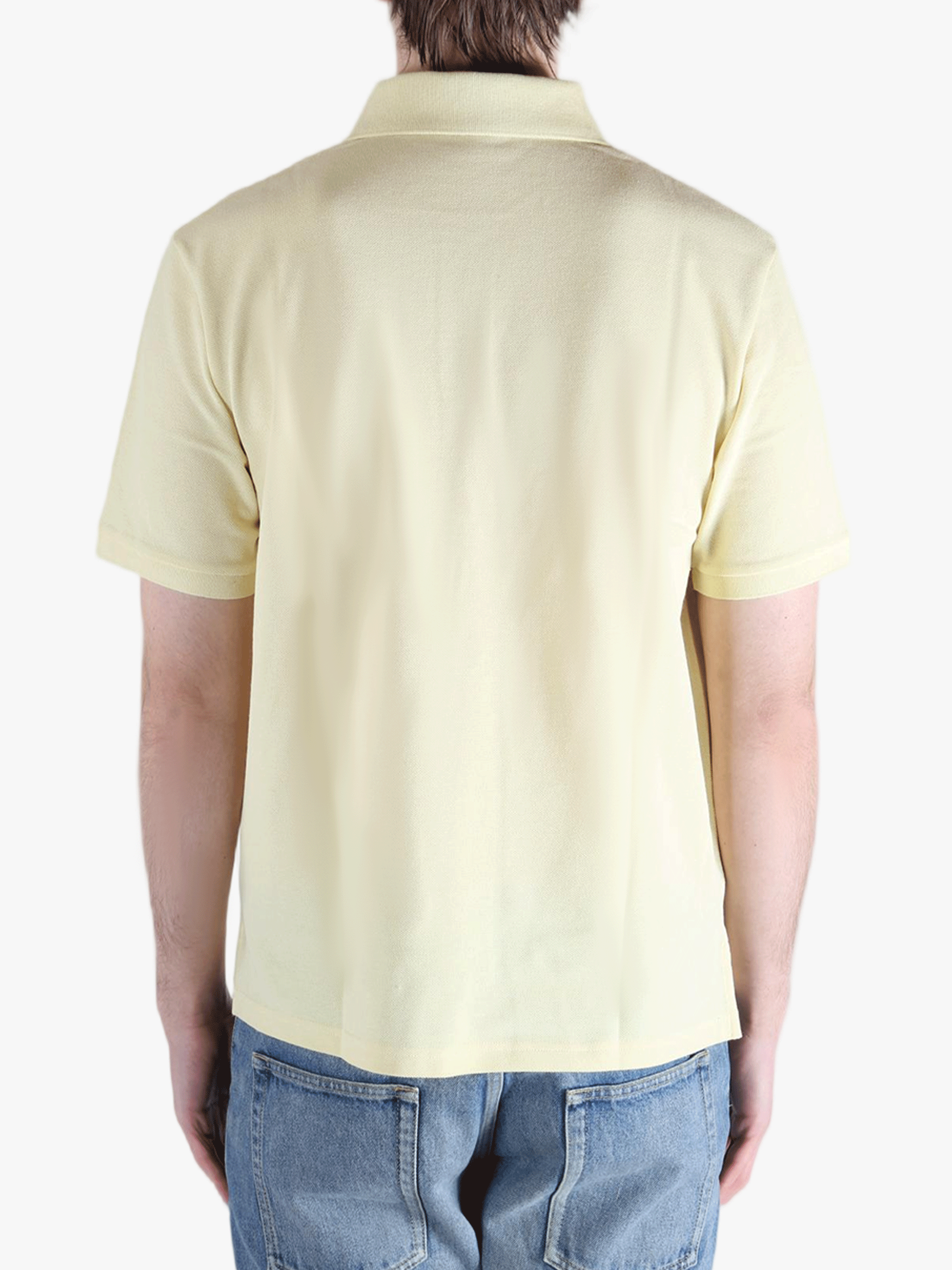 Tan shirt worn by a person, showing the fit