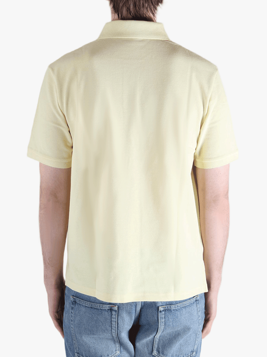 Tan shirt worn by a person, showing the fit