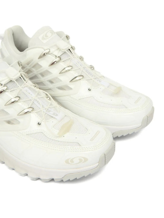 Cloes up of white sneakers, showing texture of the fabric