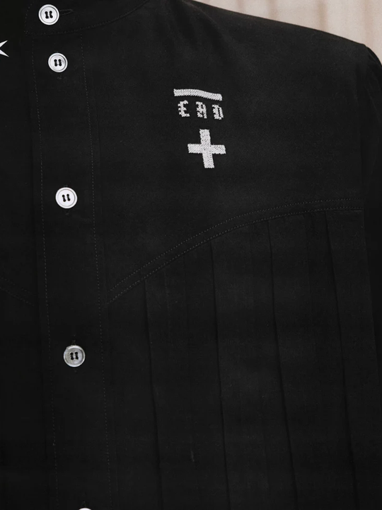 Close up of Black shirt, showing texture of the 100% cotton fabric
