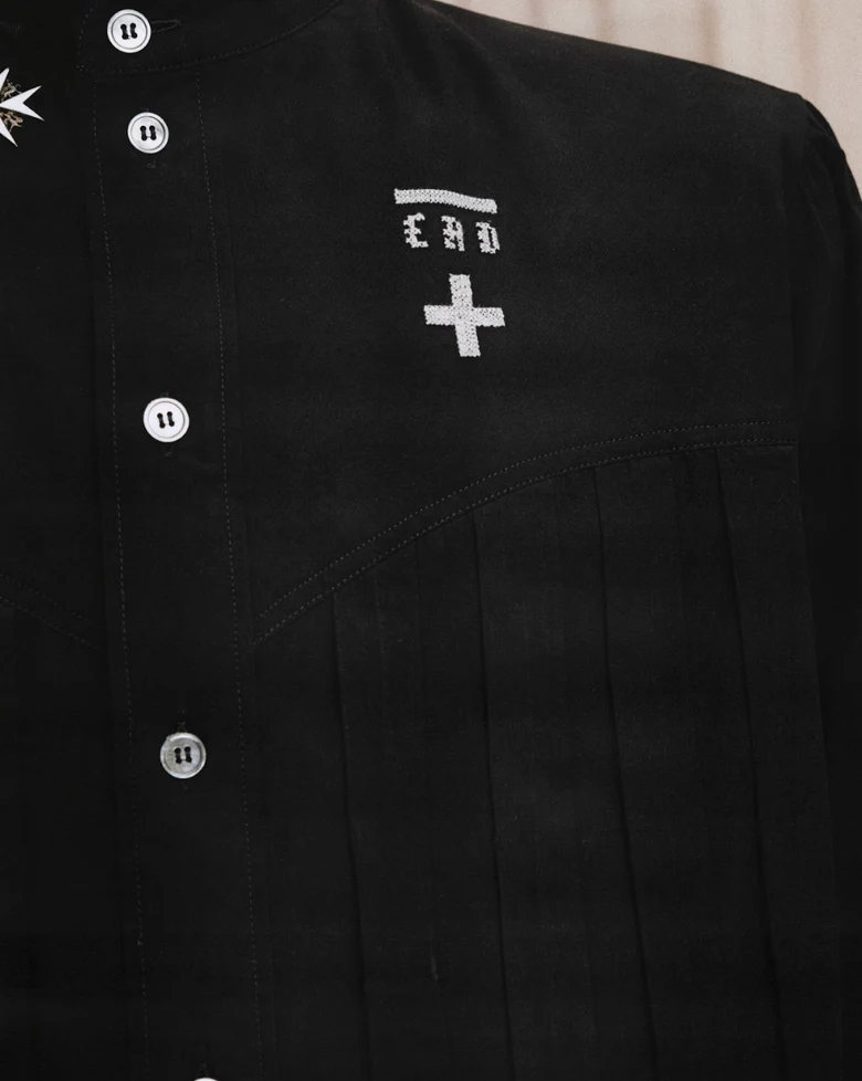 Close up of Black shirt, showing texture of the 100% cotton fabric