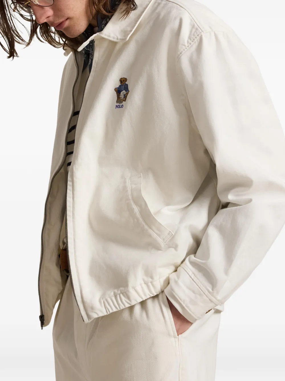 White coat worn by a person, showing the  coat's fit