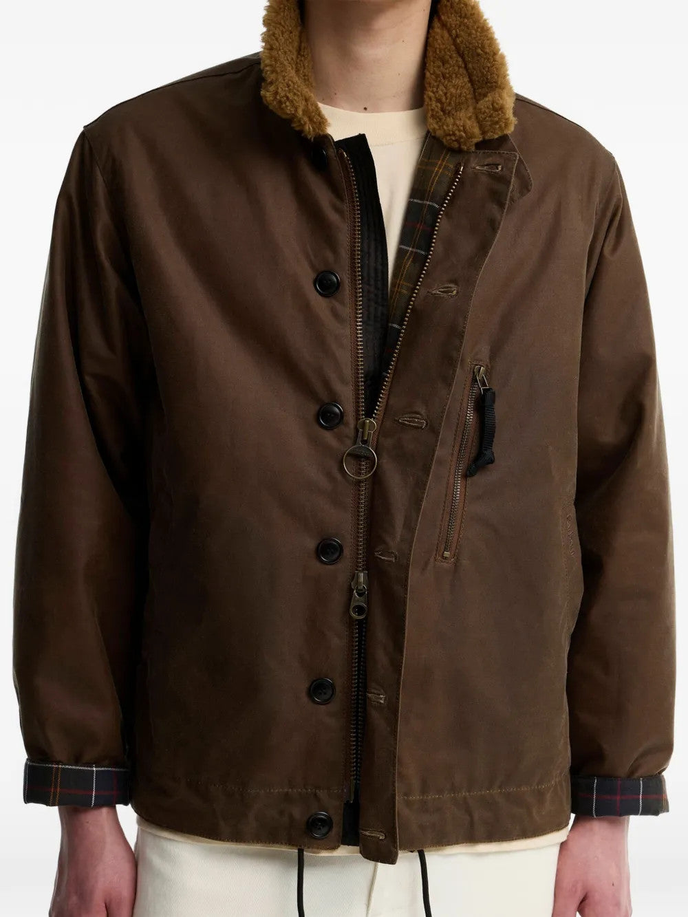 Brown jacket worn by a person, showing the jacket fit