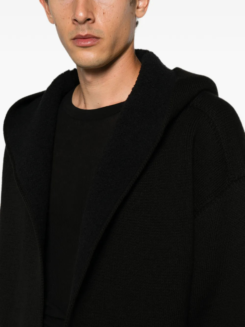 Black hoodie worn by a person, showing the hoodie fit