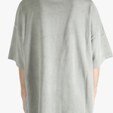 Grey t-shirt worn by a person, showing the t-shirt's fit