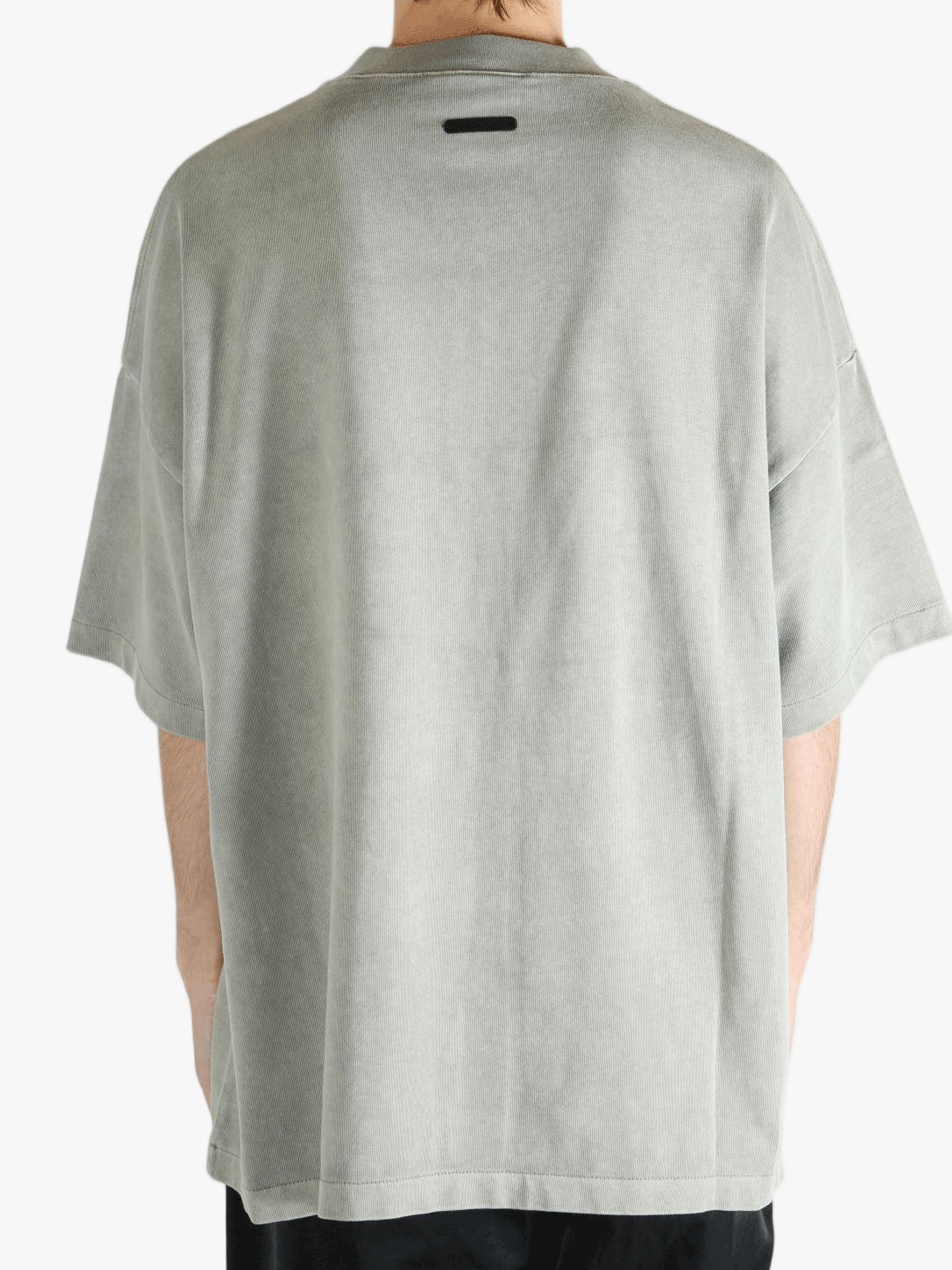 Grey t-shirt worn by a person, showing the t-shirt's fit