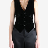 Black coat worn by a person, showing the coat's fit