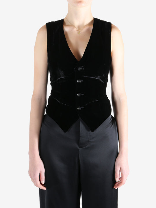 Black coat worn by a person, showing the coat's fit