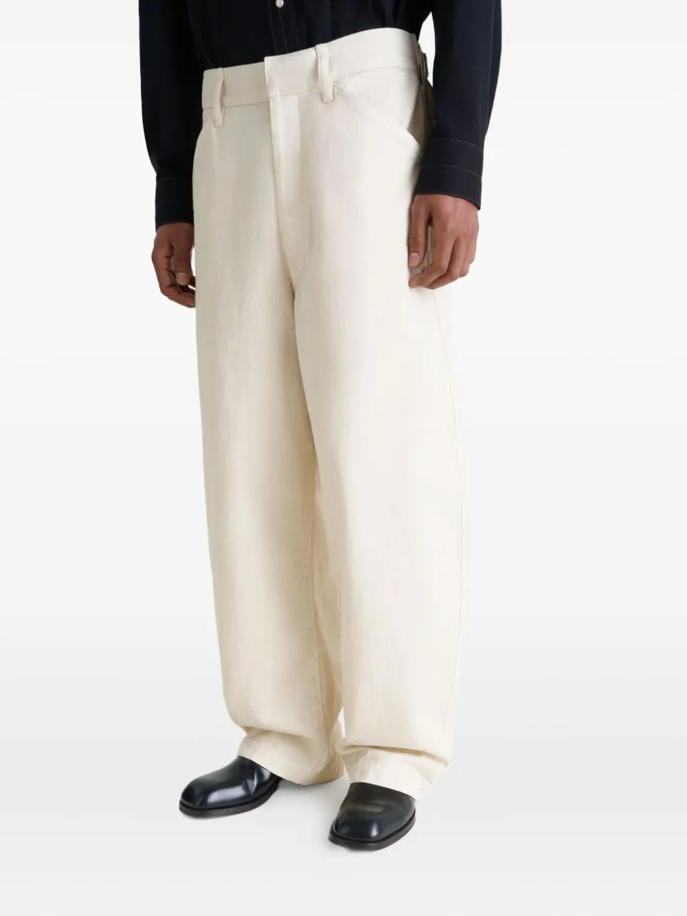 Black boot worn by a person, showing the boot's fit