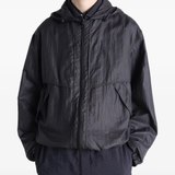 Black jacket worn by a person, showing the jacket fit