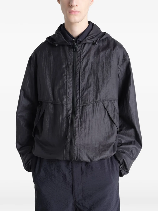 Black jacket worn by a person, showing the jacket fit