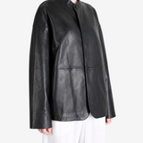 Black jacket worn by a person, showing the jacket fit