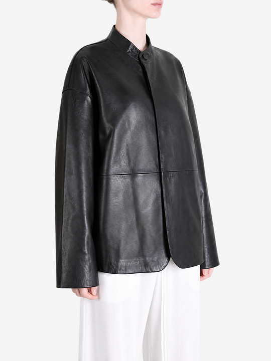 Black jacket worn by a person, showing the jacket fit