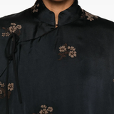Close up of black jackets, showing texture of the fabric