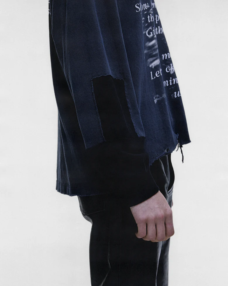 Black t-shirt worn by a person, showing the t-shirt fit