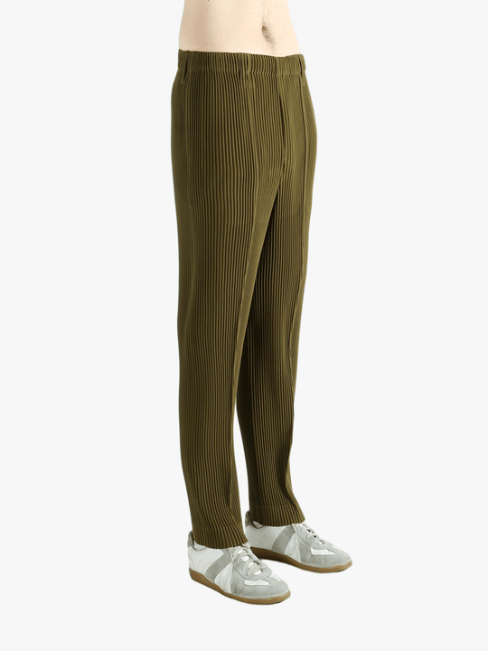 Green pants worn by a person, showing the pants' fit