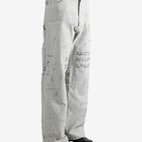 Grey pant worn by a person, showing the pant's fit