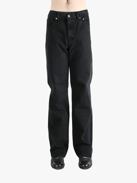 Black pant worn by a person, showing the pant's fit