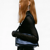 Black bag worn by a person, showing the bags fit