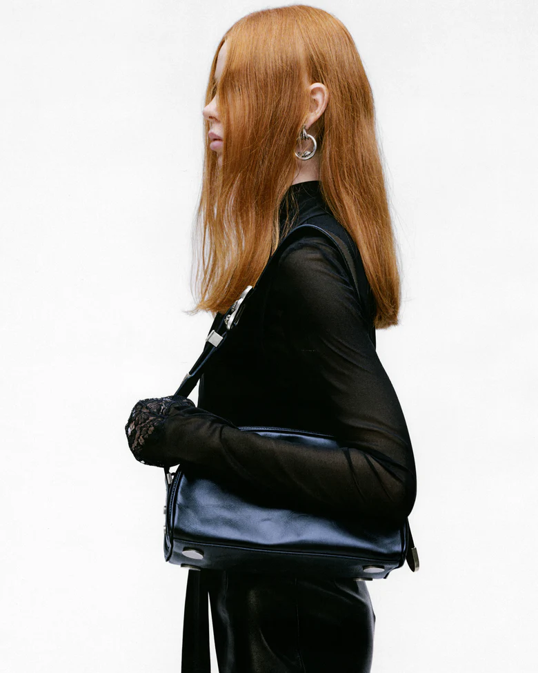 Black bag worn by a person, showing the bags fit