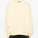 Yellow sweater worn by a person, showing the sweater fit