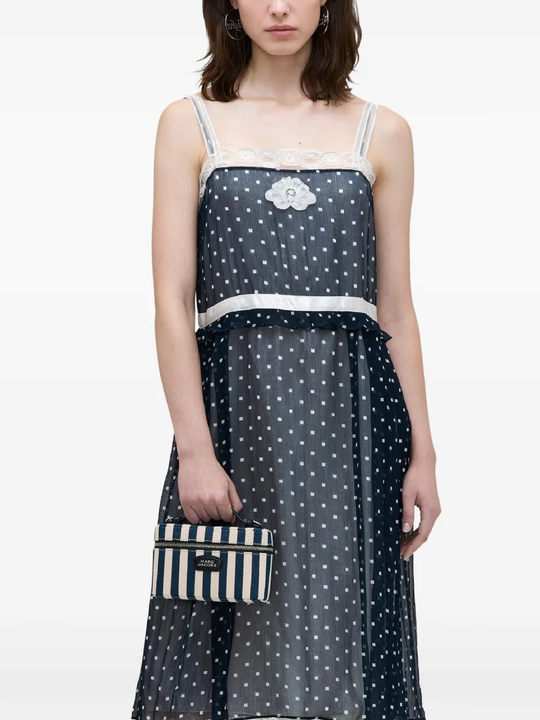 blue bags worn by a person, showing the bags fit