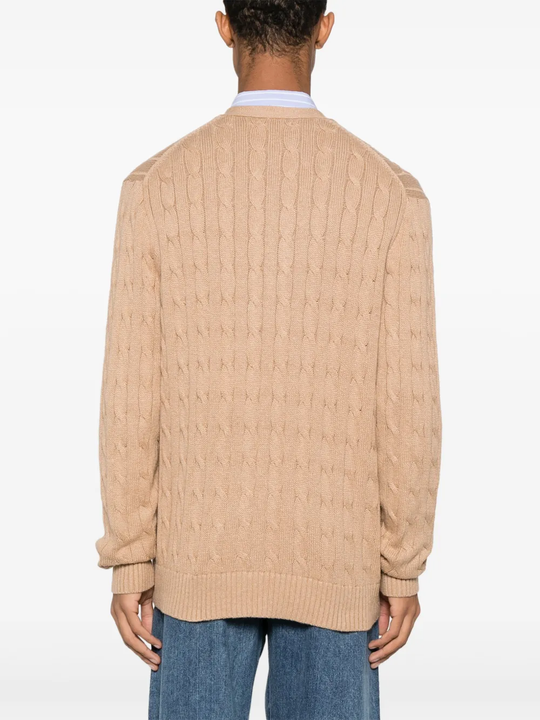 Tan cardigan worn by a person, showing the cardigan fit
