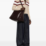 brown bags worn by a person, showing the bags fit