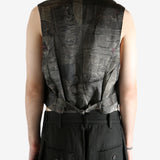 Grey vest worn by a person, showing the vest's fit