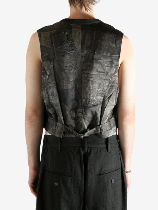 Grey vest worn by a person, showing the vest's fit