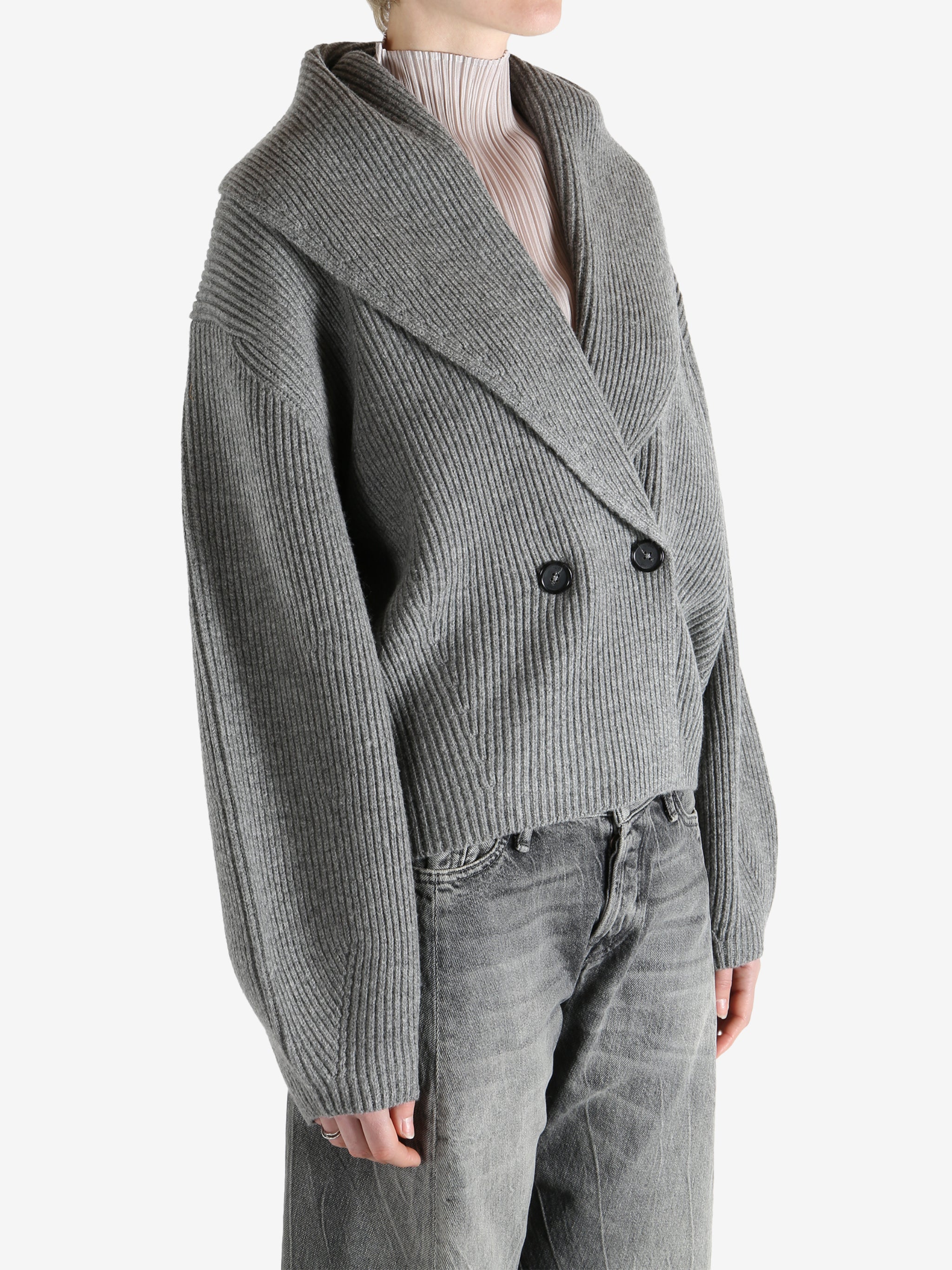  gray sweater  worn by a person, showing the sweater fit