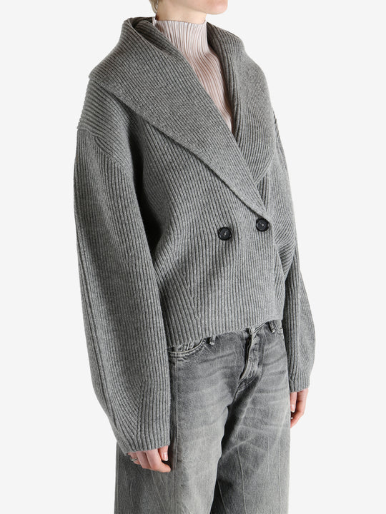  gray sweater  worn by a person, showing the sweater fit