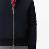Navy jacket worn by a person, showing the jacket fit