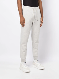 Grey pants worn by a person, showing the pants' fit