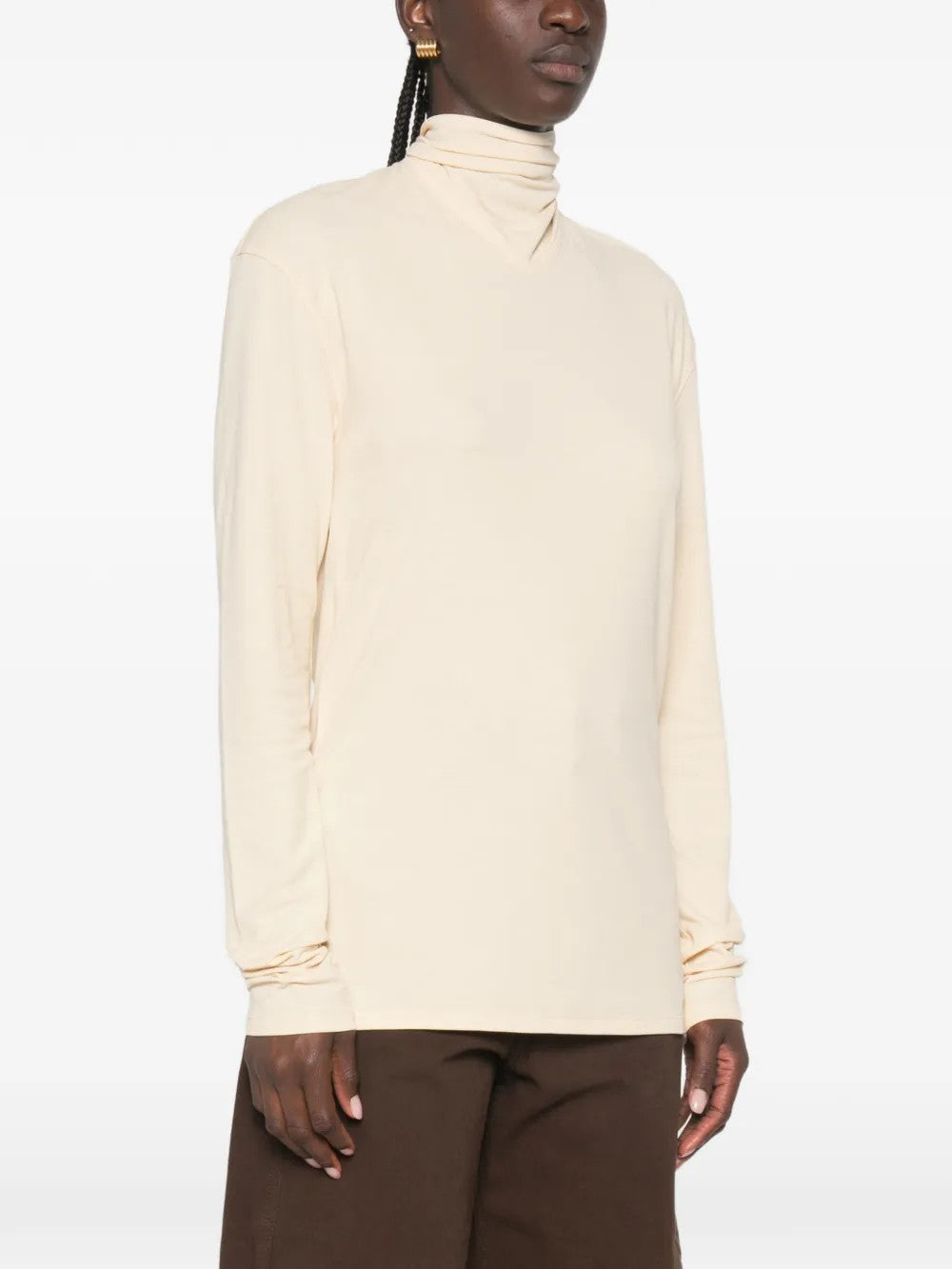 Tan top worn by a person, showing the top fit