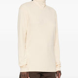 Tan top worn by a person, showing the top fit