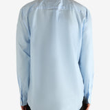 Blue shirt worn by a person, showing the shirt's fit