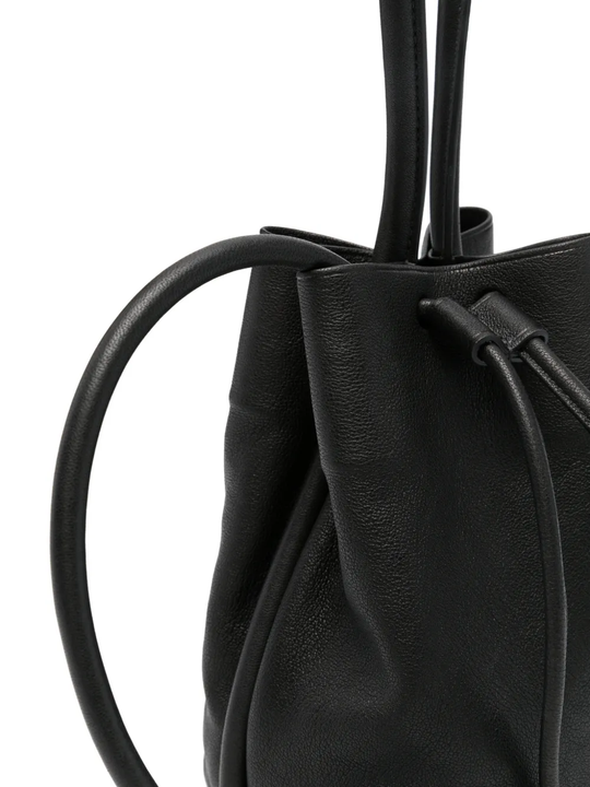 Close up of black bag, showing texture of the calf leather fabric