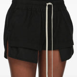 Black shorts worn by a person, showing the shorts fit