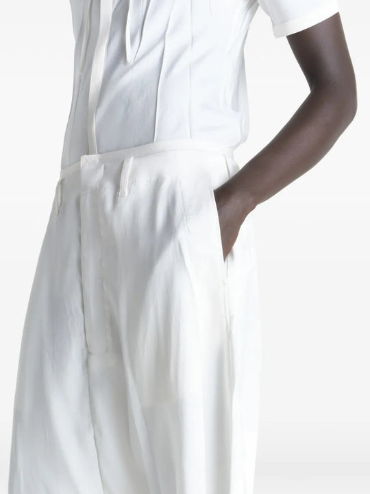 Close up of the white shorts, showing texture of the viscose fabric