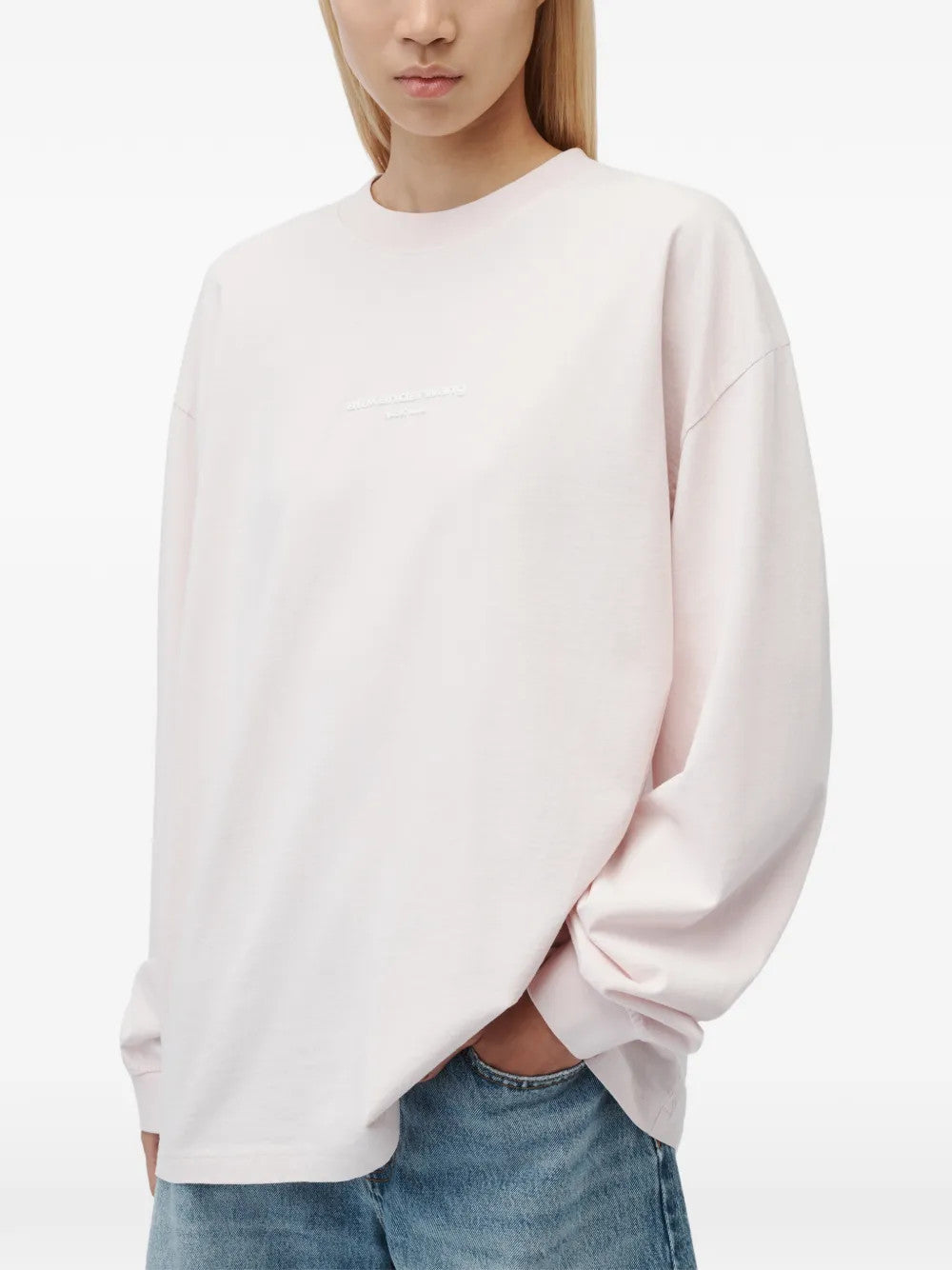 Pink t-shirt worn by a person, showing the t-shirt fit