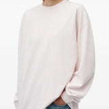 Pink t-shirt worn by a person, showing the t-shirt fit