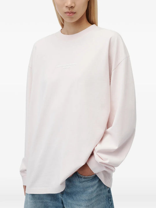 Pink t-shirt worn by a person, showing the t-shirt fit