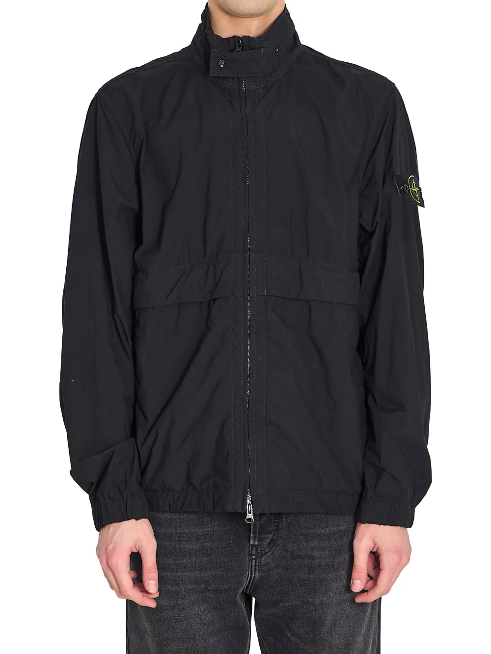 Black jacket worn by a person, showing the black jacket's fit