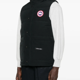 Black vest worn by a person, showing the vest fit