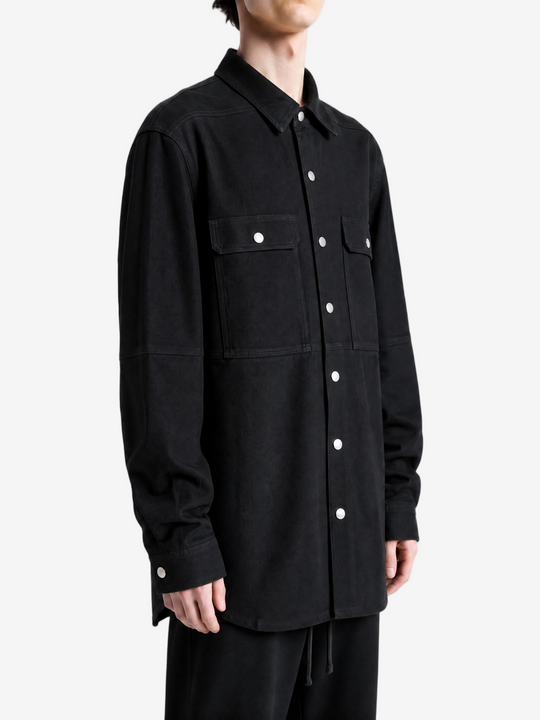 Black shirt worn by a person, showing the shirt fit