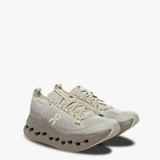 Tan sneakers, side view