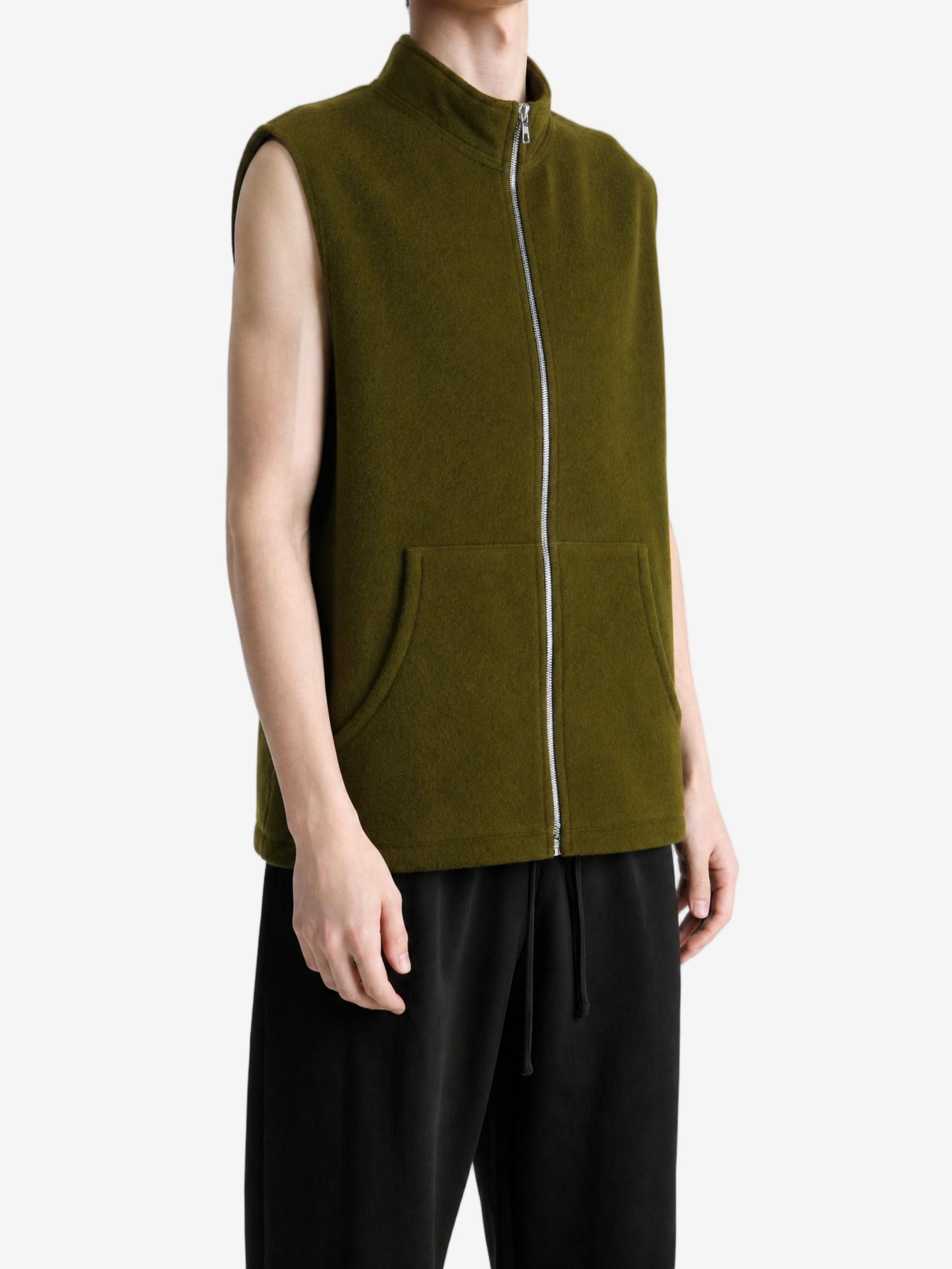 Green top worn by a person, showing the top fit