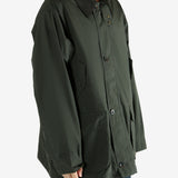 Green jacket worn by a person, showing the jacket's fit