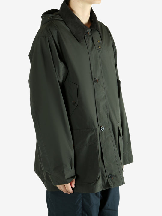 Green jacket worn by a person, showing the jacket's fit